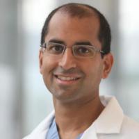 Portrait image of Dr. Ajay Kirtane in his white lab coat